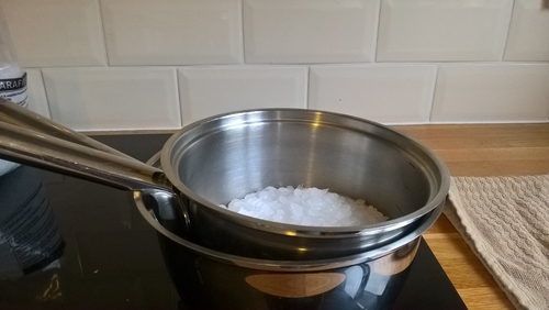 Boiling wax in a pan and bain marie
