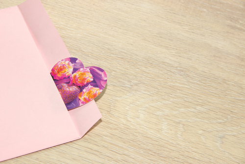 roses, love heart valentine's card in pink envelope