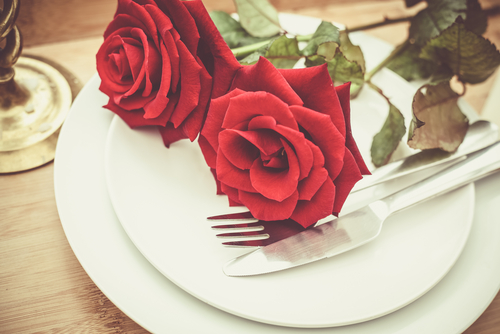 red roses on dinner plate
