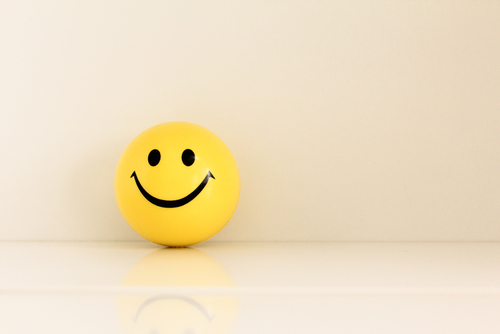 Yellow smiley face ball toy