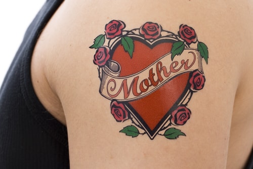 Mother tattoo on arm of man