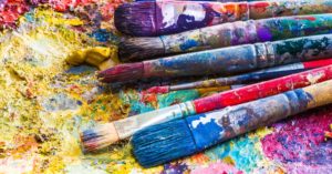 Paintbrushes covered in paint
