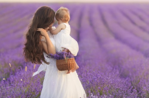mother and baby on a field of Lavender