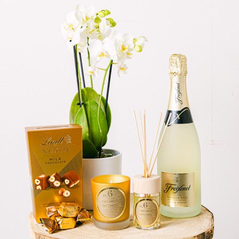 Golden Charm: Candle, Mikado, Cava & Orchid